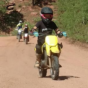 Picture of kids riding dirtbikes with lessons near Denver.